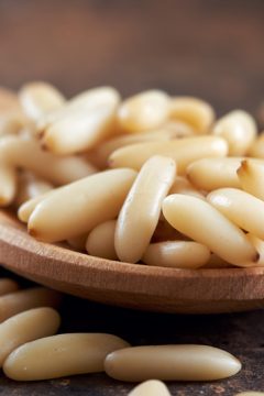pine-nuts-on-a-wooden-spoon
