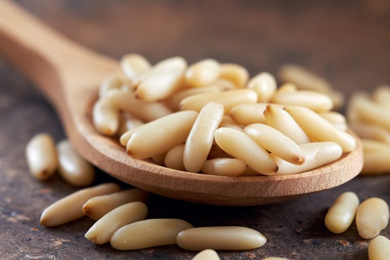 pine-nuts-on-a-wooden-spoon