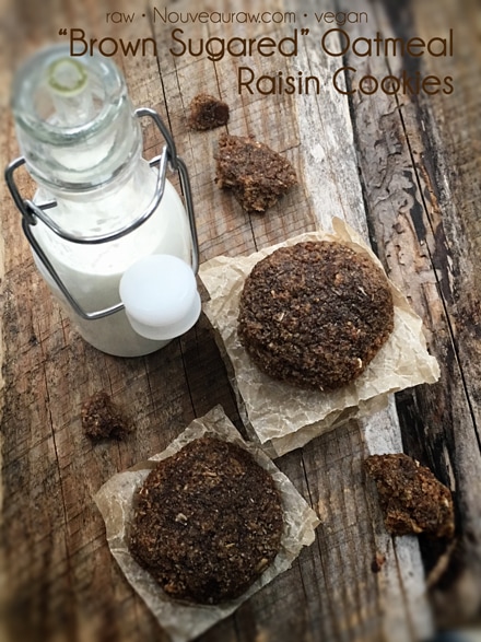 raw vegan Brown Sugared Oatmeal Raisin Cookies displayed on a wooden table