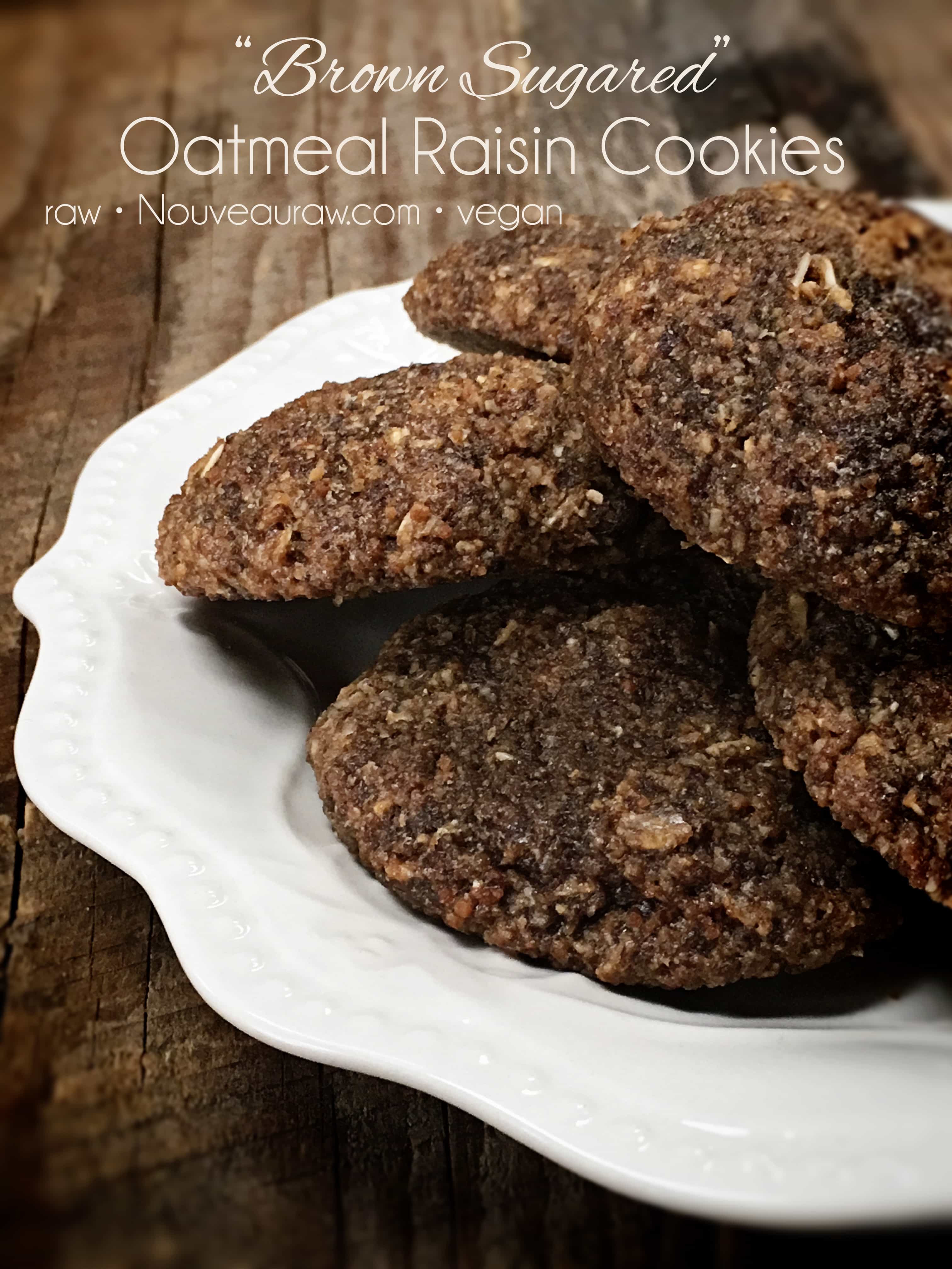 a close up of raw vegan Brown Sugared Oatmeal Raisin Cookies displayed on a wooden table