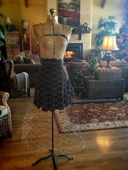 add chicken wire over the skirt to the antique dress form