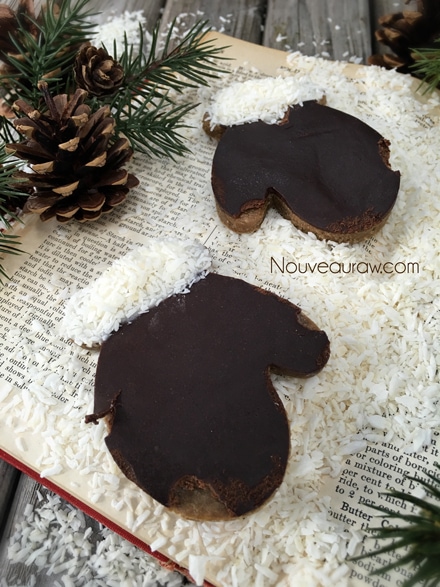 a close up of decorated Hum Mud Gingerbread Men cookies shapes like mittens