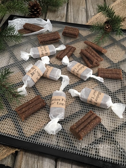  Oldfather “Licorice” Logs displayed on a wooden table with labels wrapped around them