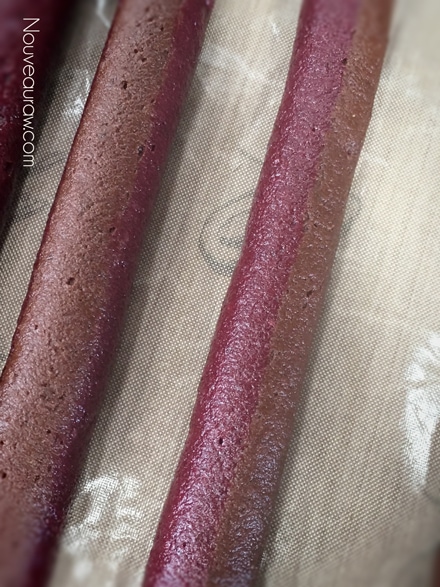a close up of how the piping the Raspberry Chocolate Tootsie Chews look before dehydrating them
