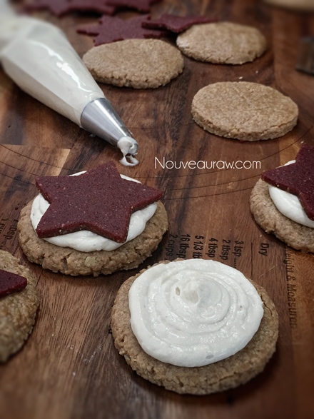 piping the icing on the raw vegan Peppermint Dream Almond Butter Cookies 