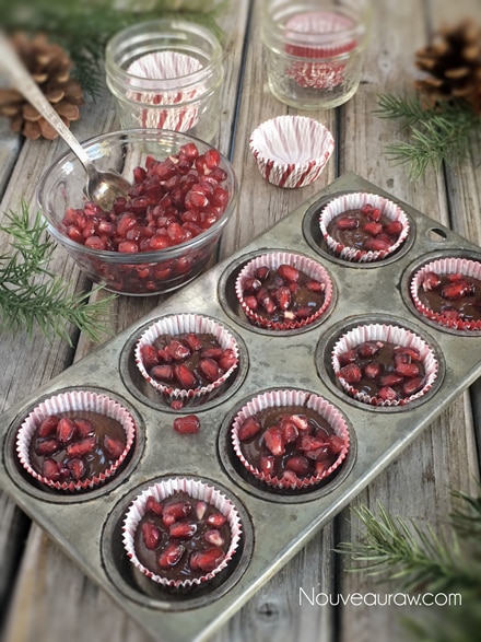topping the chocolate with pomegranate seeds