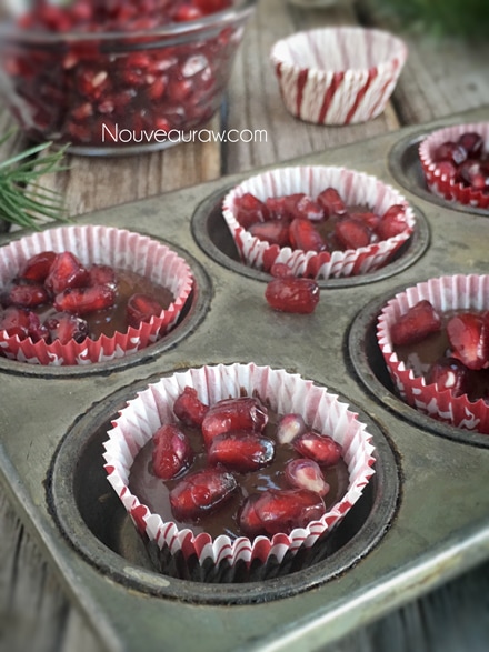 close up of Pomegranate Chocolate Clusters displayed in an old antique muffin tin