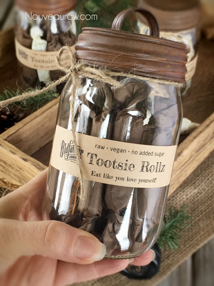  a close up of a labeled jar of Tootsie Rollz