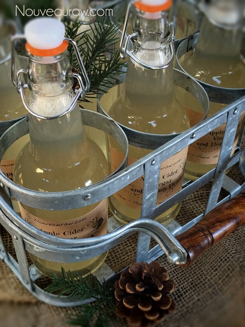 alkalizing Apple Cider Vinegar and Honey Drink in bottles in a milk crate