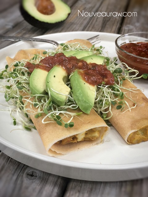 A mouth-watering Morning Glory 'Egg'Salad Burito with fresh avocados and sprouts on top