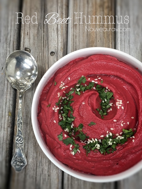 Red Beet Hummus served in a white bowl