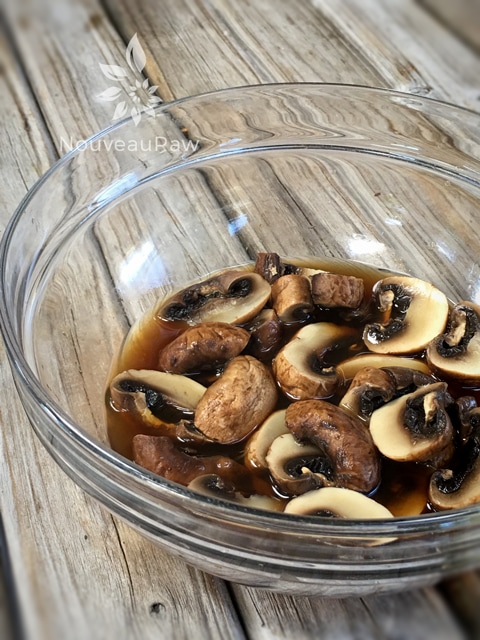 marinating mushrooms for making raw vegan gluten free Black Bean and Mushroom Burger 