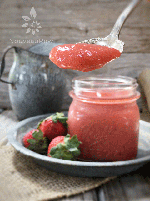 rhubarb and strawberry sauce displayed close up on a spoon