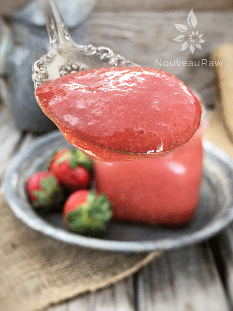 a close up of Rhubarb and Strawberry sauce on a spoon. Sweet and delicious