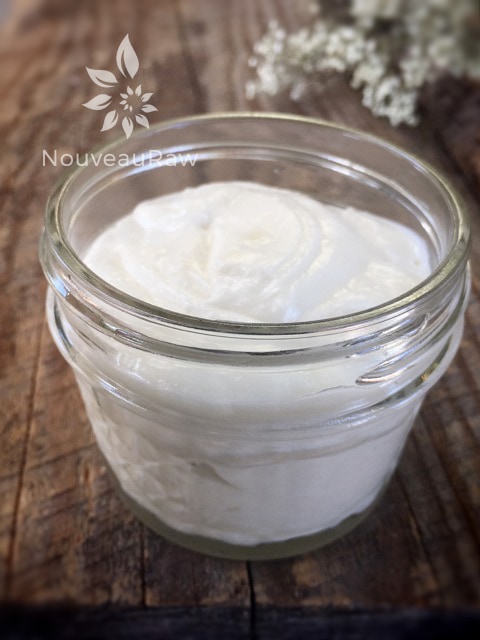 looking into the jar of a close up Sweet Almond and Orange Body Butter in a small mason jar