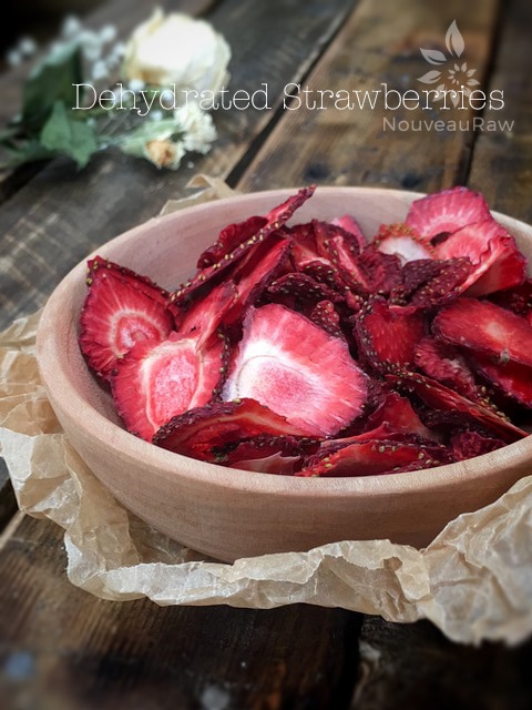 dehydrated strawberries displayed in a hand-made wooden bowl