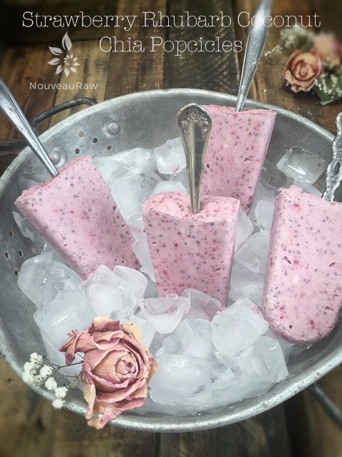 raw vegan Strawberry Rhubarb Coconut Chia Popsicles with old spoons for the handles