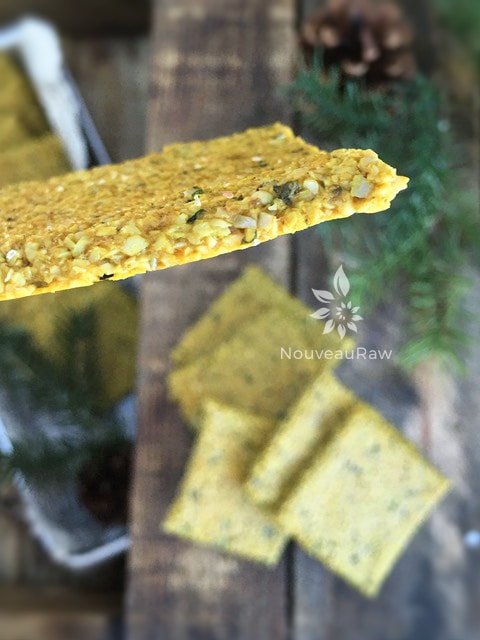 the side view of the raw vegan Thai Crackers displayed on a wooden table