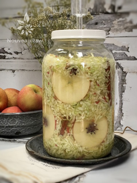 tall jar of Apple Cinnamon Spice Sauerkraut fermenting