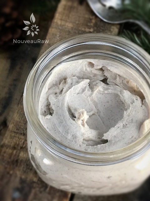 an over view of creamy raw, vegan pumpkin spiced ginger frosting presented in a jar