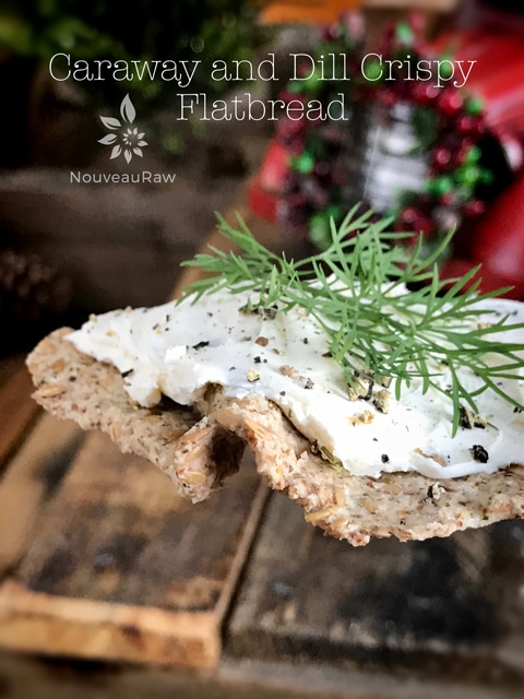 raw vegan gluten-free Caraway and Dill Crispy Flatbread with probiotic rich cheese on top