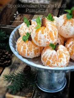 Spooktacular Orange Fruit Pumpkins displayed on a silver tray for Halloween