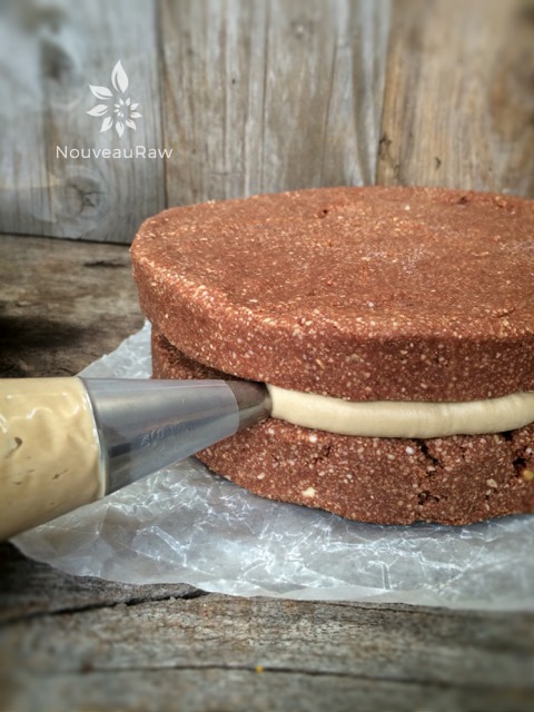 piping Raw-Espresso-Buttercream between the two layers