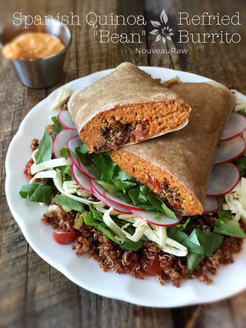 Spanish Quinoa and Refried "Bean" Burrito served on a bed of veggies