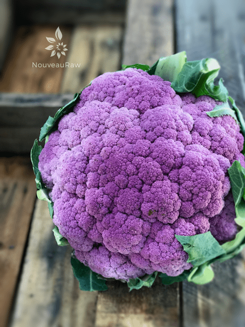 purple cauliflower on a piece of barn wood