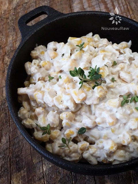 raw vegan creamed corn served in a cast iron dish