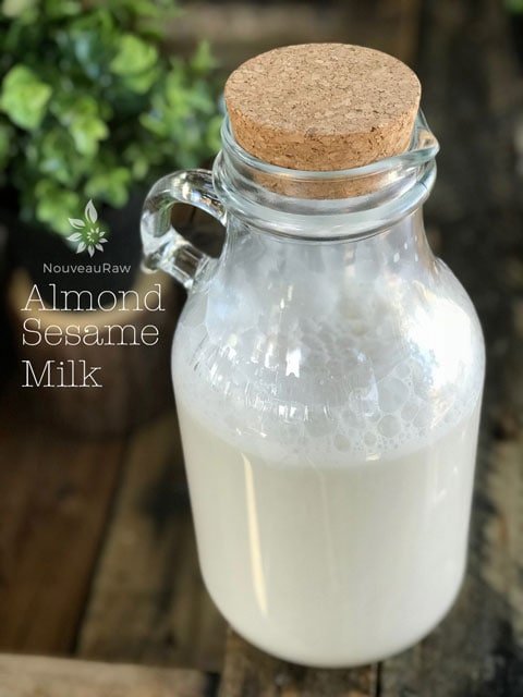 a half gallon jar of mug of raw vegan Almond-Sesame-Milk