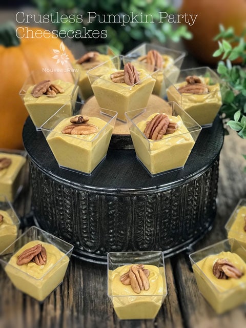 Raw vegan Crustless Pumpkin Party Cheesecakes served on a fancy cake pan