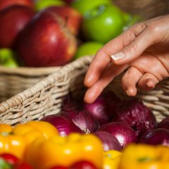 hand reaching to select fresh produce