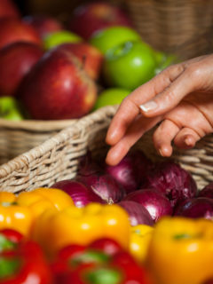 hand reaching to select fresh produce