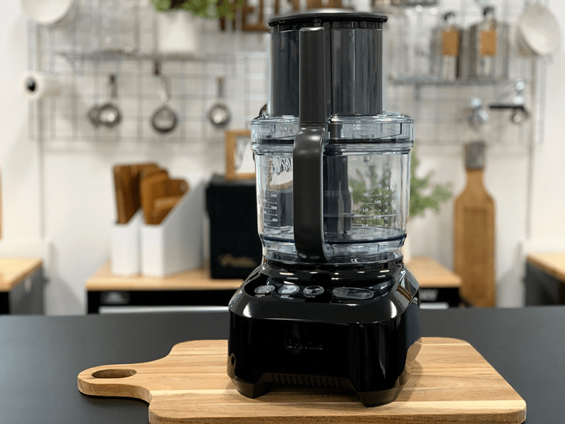 https://nouveauraw.com/wp-content/uploads/2019/02/black-food-processor-on-wooden-cutting-board-800-800x600.png